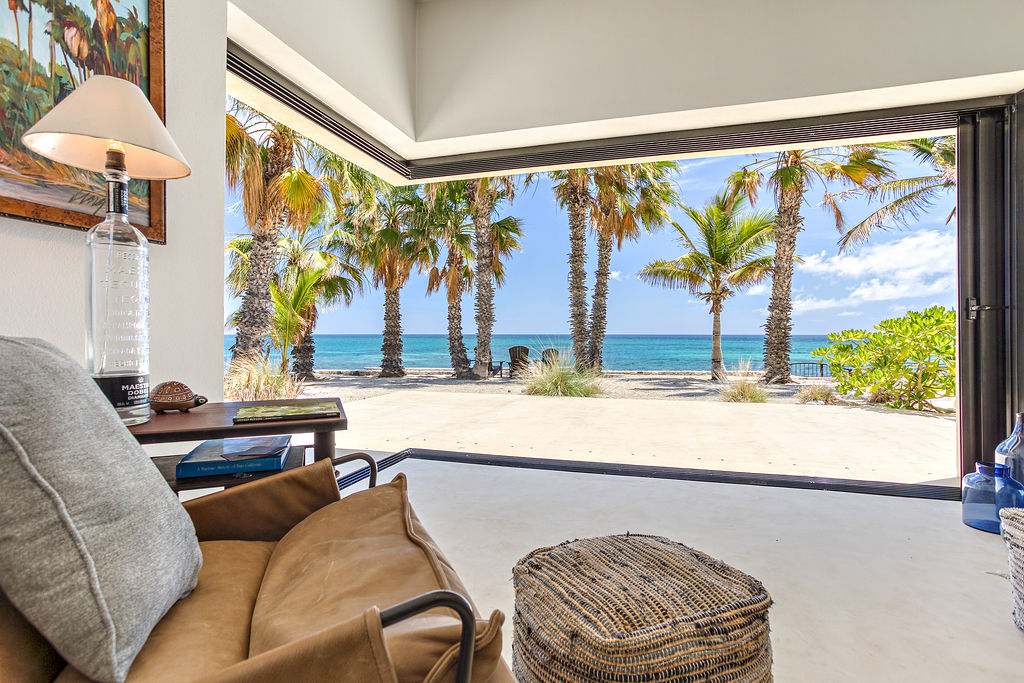 Living room with full wall of glass opening to the Sea of Cortez